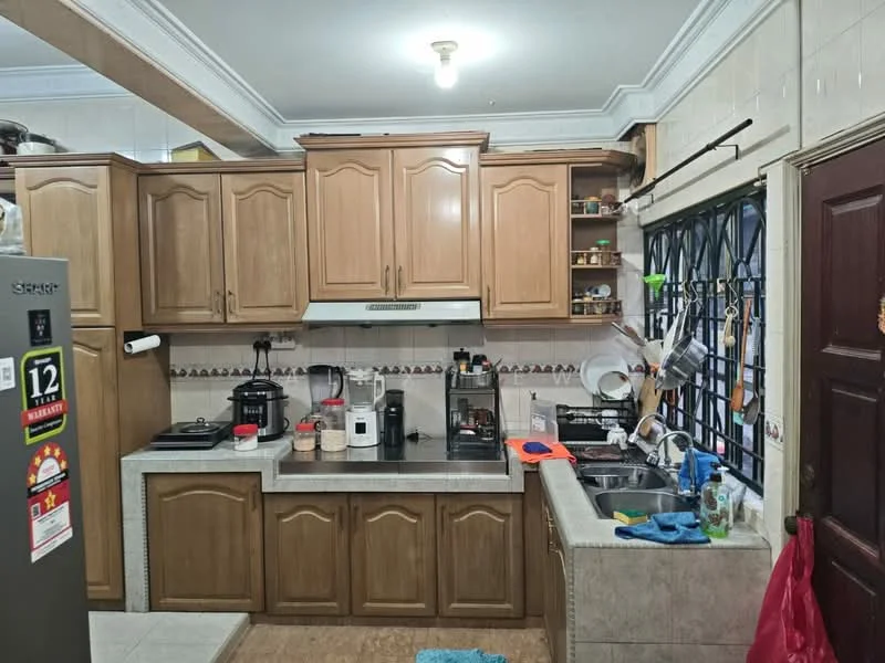 Kitchen features: brown wooden cabinetry, stainless-steel sink, chrome pull-down faucet, granite countertop, built-in oven, freestanding range oven, microwave, refrigerator, tile backsplash, ceramic tile flooring, ceiling light fixture, window with metal grille, kitchen utensils and appliances visible; style: traditional.