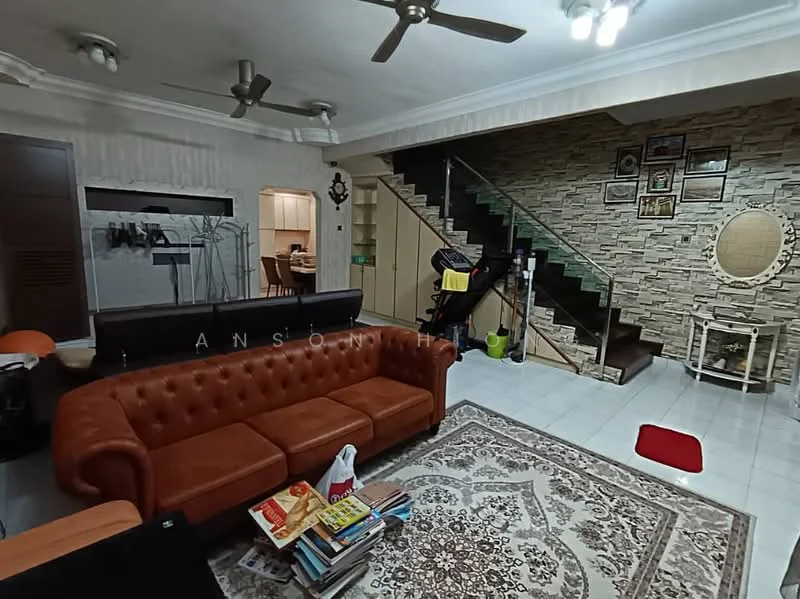Living features: 3-seater leather sofa in brown, coffee table, area rug with intricate pattern, wall-mounted TV, ceiling fan with light, decorative wall with stone cladding, staircase with wooden railing, framed artwork on wall, built-in shelving unit, light-colored tiled flooring; style: contemporary. Room features: open layout to dining area, staircase leading to upper floor, wall with decorative frames.