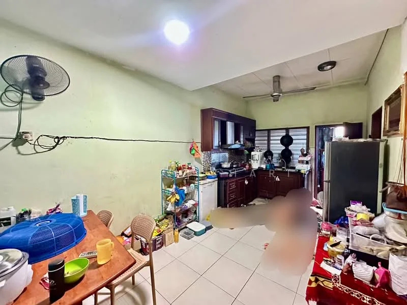 Kitchen features: green painted walls, white tiled flooring, ceiling fan, wood cabinetry, stainless-steel fridge, built-in oven, freestanding gas stove, kitchen sink, countertop with clutter, dining table with chairs, open shelving with kitchen items, window with blinds.