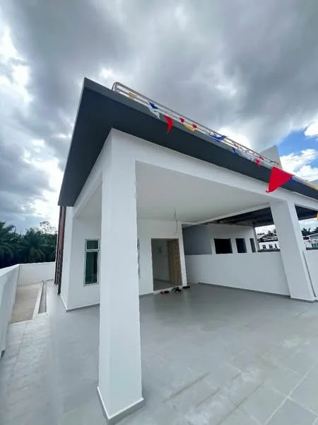 Exterior features: white painted facade, flat roof, open terrace, grey tiled flooring, surrounded by walls, overhang for shade, decorative flags, large windows, doorway entrance; style: modern.