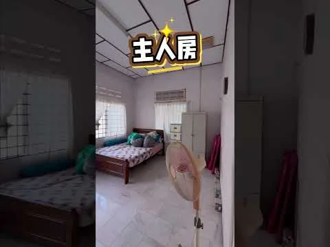 Bedroom features: two single beds with patterned bedding, white painted walls, marble flooring, window with grid pattern, curtains in red, ceiling fan, built-in wardrobe, decorative wall shelf.