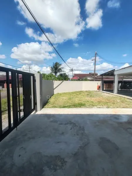 Exterior features: concrete flooring, manicured lawn, fenced perimeter, clear blue sky, power lines visible, surrounding residential area.