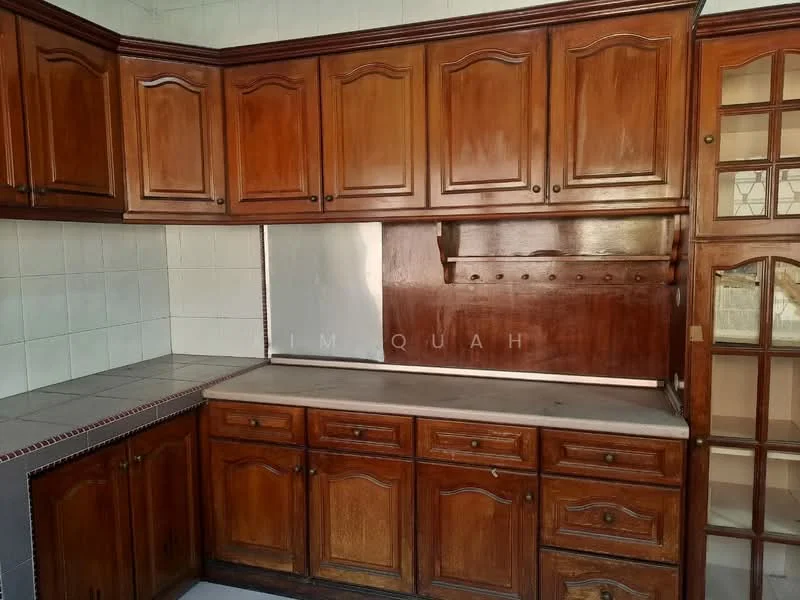 Kitchen features: wood cabinetry with raised panel doors, laminate countertop, white tiled backsplash, built-in shelving, single-bowl stainless-steel sink, chrome faucet, dark wood cabinet handles, tile flooring; style: traditional.