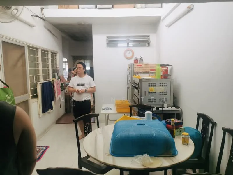 Room features: white painted walls, tile flooring, ceiling lights, dining table with chairs, kitchen cabinets, stainless-steel refrigerator, kitchen countertop, laundry area with hanging clothes, window with metal grille, decorative rug; style: modern.