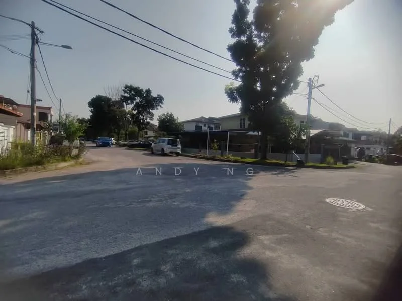 Exterior features: residential street, paved road, surrounding greenery, utility poles, street lighting, single-storey houses, open space, curved road.