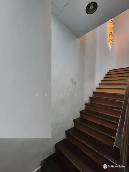 Room features: wooden staircase, white painted walls, recessed ceiling lights, wall-mounted light fixture; style: modern.