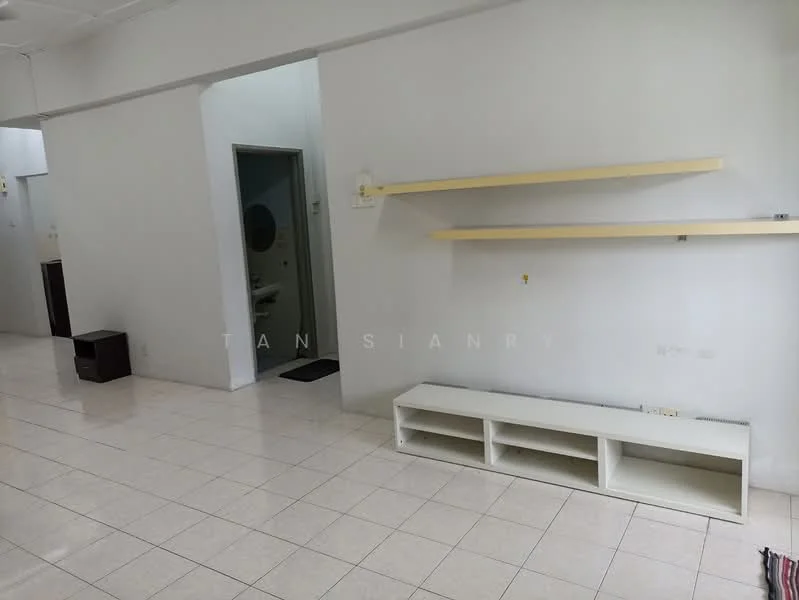 Room features: white painted walls, glossy tile flooring, shelves mounted on wall, built-in TV console, doorway leading to bathroom, neutral color scheme, open layout, no visible furniture; style: modern.