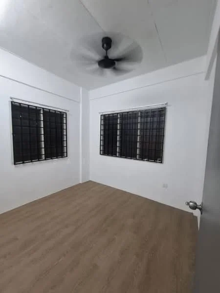 Room features: white painted walls, laminate flooring, 2 windows with black metal grilles, ceiling fan, light fixture, corner room, neutral decor; style: modern.