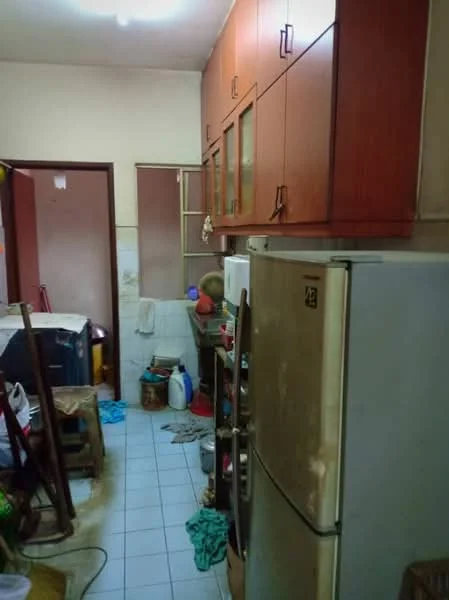 Kitchen features: wood cabinetry with glass-front upper cabinets, stainless-steel fridge, white tiled flooring, white tiled walls, countertop with clutter, sink, microwave, kitchen utensils, dirty dishes, open shelving, window, light fixture on ceiling.