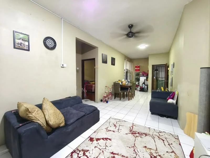 Living features: white painted walls, tiled flooring, 5-blade ceiling fan, 2-seater fabric sofa in navy blue, 3-seater fabric sofa in dark grey, area rug with abstract pattern, wall-mounted artwork, decorative wall clock, open layout leading to kitchen, natural light from adjacent room; style: modern.