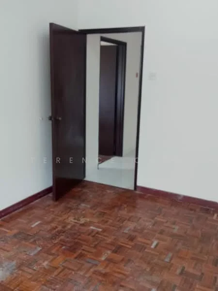 Room features: wooden flooring, white painted walls, brown wooden door, mirror on door, door frame, light switch, baseboard, corner of another room visible.