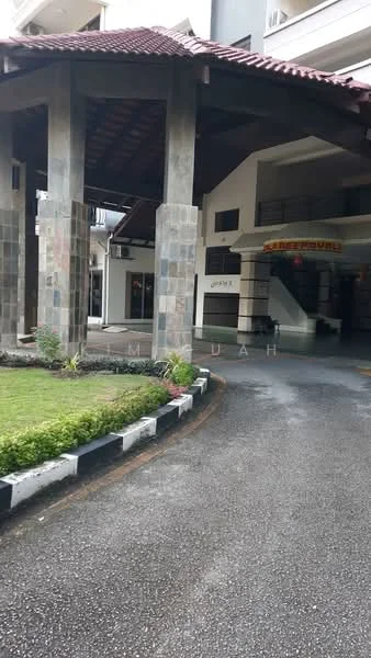 Exterior type: low-rise apartment block; features: stone cladding on columns, red tiled roof, manicured lawn, paved driveway, covered entrance, landscaped garden, open-air parking area; style: tropical-modern.