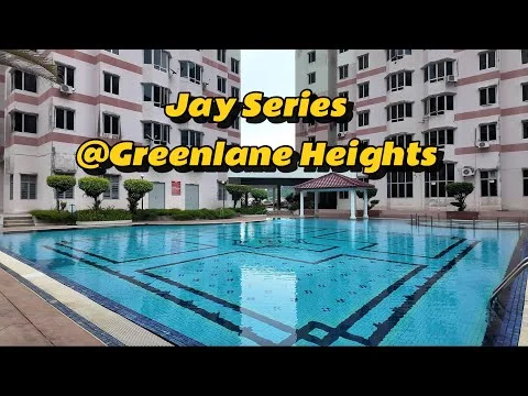 Exterior type: mid-rise condominium; features: swimming pool, pool deck with loungers, landscaped garden, palm trees, gazebo, balconies on building facade, multiple air conditioning units visible, manicured lawn; style: modern.
