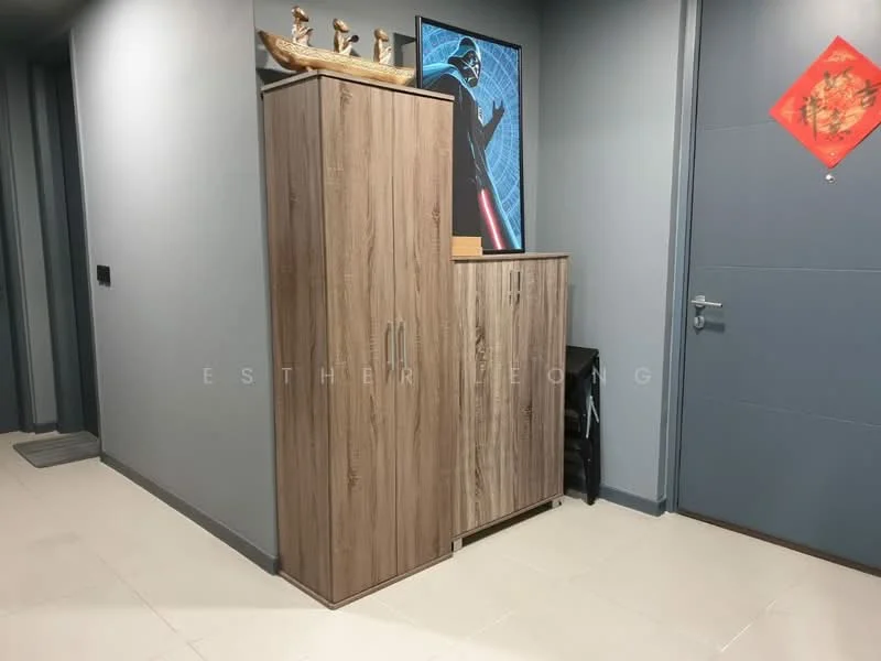 Room features: light grey painted walls, wooden cabinets in light brown finish, floor tiles in cream color, framed artwork on wall, red decorative wall hanging, door with silver handle, wall-mounted light switch, baseboard trim; style: modern.