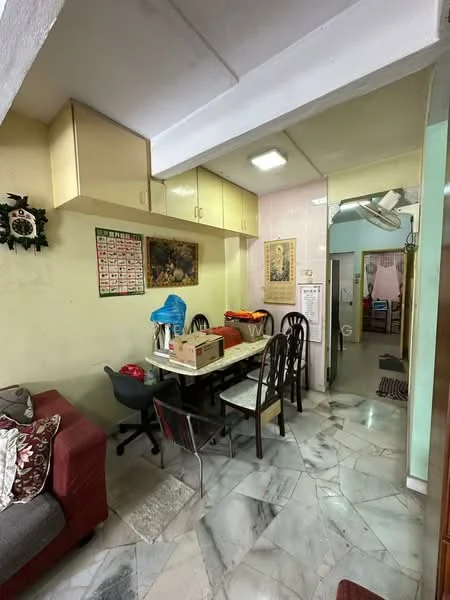 Dining features: marble flooring, cream painted walls, ceiling light fixture, dining table with chairs, wall-mounted calendar, framed artwork, sofa with cushions, built-in cabinets above the table.
