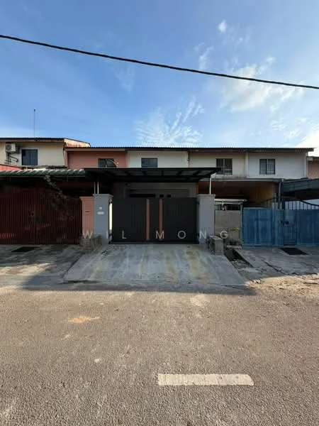 Exterior type: linked terrace house; features: red painted facade, blue painted facade, metal gate, concrete driveway, single-storey, roof overhang, surrounded by low fencing, visible utility lines, clear sky, paved road; style: traditional.