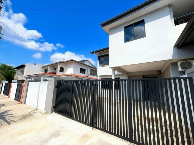 Exterior type: semi-detached house; features: white painted facade, flat roof, black metal gate, driveway, air conditioning unit visible, two-storey structure, manicured landscaping, surrounded by residential area; style: modern.