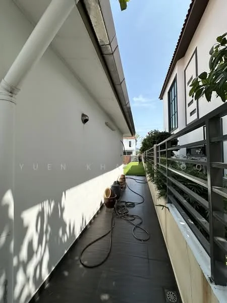 Exterior features: narrow walkway, white painted walls, metal railing, landscaped garden, potted plants, outdoor lighting, drainage pipe, stone-paved pathway; style: modern.