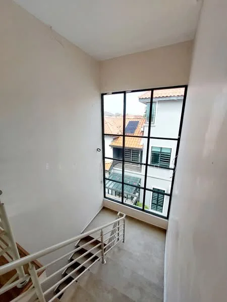 Room features: staircase with metal railing, large windows with black frames, white painted walls, natural light from windows, wooden steps, tile flooring, view of neighboring houses, roof tiles visible from window; style: modern; view: neighborhood.