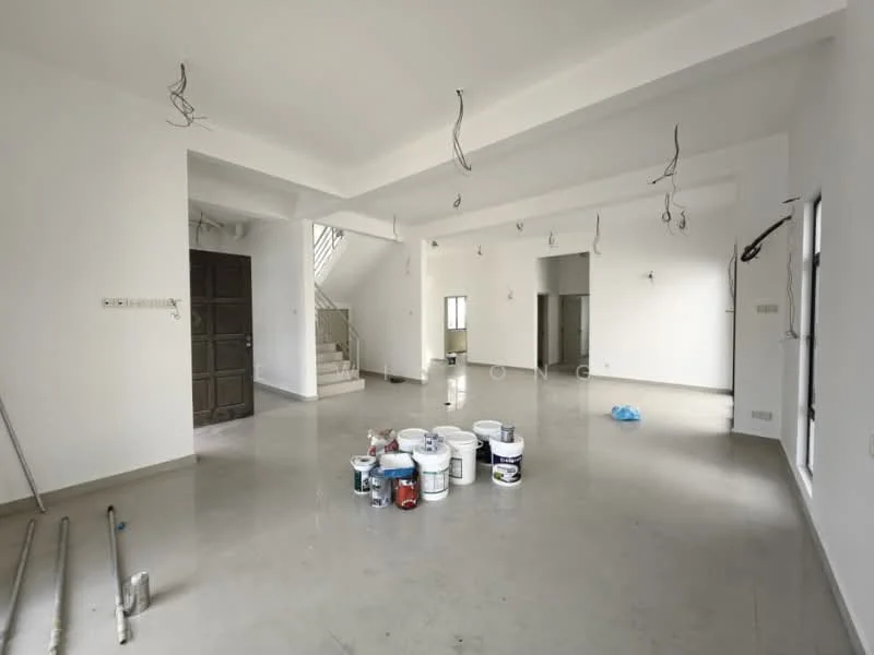 Room features: white painted walls, polished concrete flooring, tray ceiling, exposed electrical wiring, staircase leading to upper floor, multiple paint buckets, unfinished space, large windows, doorway to exterior.
