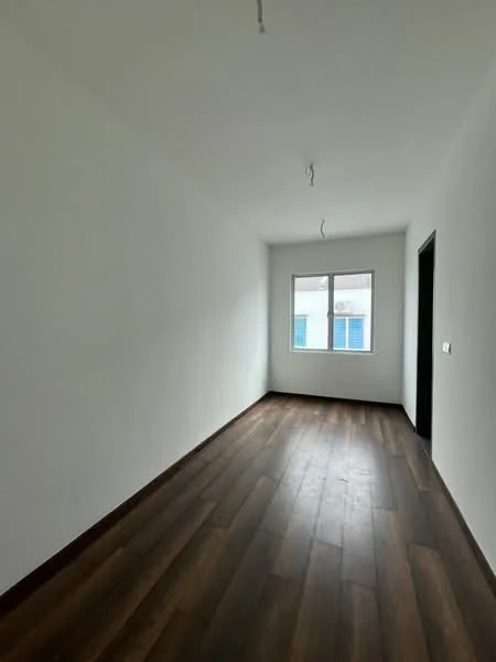 Room features: white painted walls, wooden flooring, single window, doorway, ceiling lights.