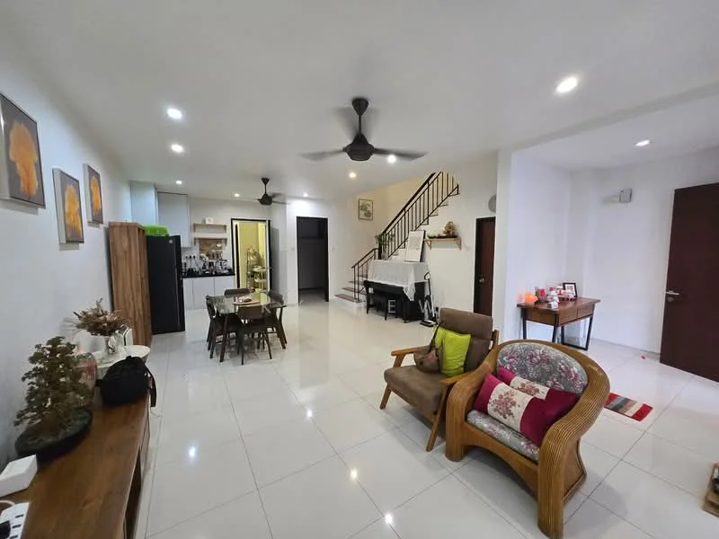Living features: white painted walls, polished ceramic tile flooring, 5-blade ceiling fan with light, sofa chair with floral cushion, wooden coffee table, dining table with four chairs, decorative wall art, staircase with wooden railing, open layout to kitchen, LED recessed lighting; style: modern. Kitchen features: white cabinetry, black countertop, stainless-steel sink, built-in oven, freestanding refrigerator, kitchen island, open layout to living area; style: modern.