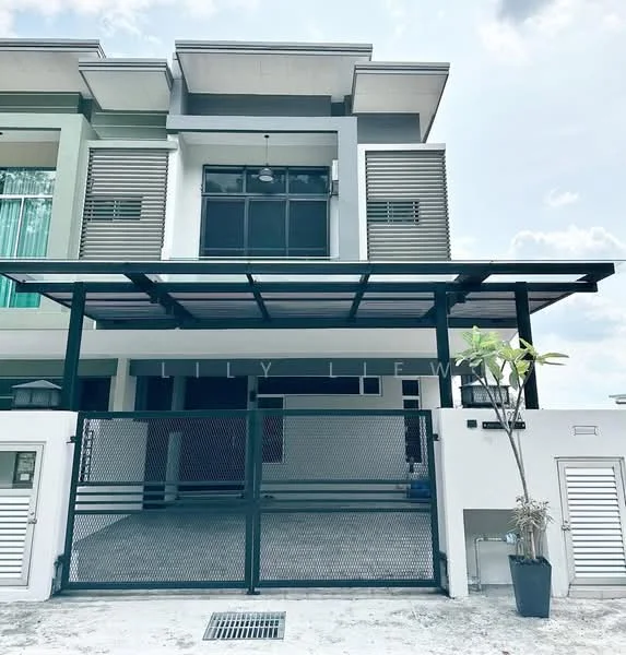 Exterior type: linked terrace house; features: two-storey building, green and grey painted facade, metal carport, gated entrance, fence with mesh, potted plant at entrance, large windows with horizontal slats, overhang roof, concrete driveway, manicured landscaping; style: modern.