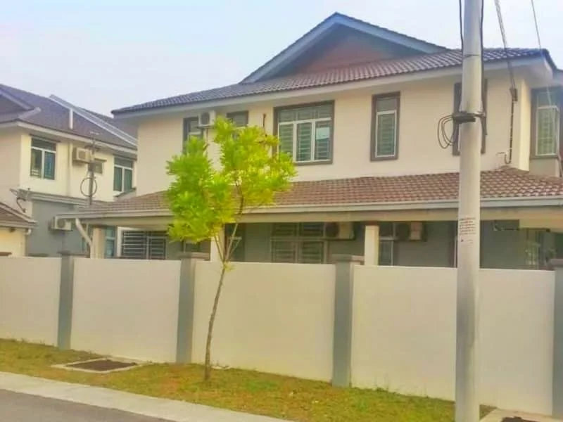 Exterior type: semi-detached house; features: grey painted facade, pitched tile roof, mature tree in front yard, manicured lawn, fenced perimeter, multiple wall-mounted split AC units, driveway with interlocking pavers; style: modern.