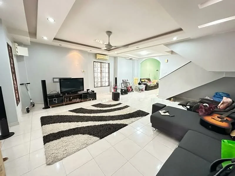 Living features: white painted walls, recessed ceiling with downlights, 5-blade ceiling fan, large window with grille, white tiled flooring, black fabric sofa, area rug with geometric pattern, TV console, wall-mounted TV, decorative items on shelves; style: modern. Room features: green painted walls, white tiled flooring, visible staircase, guitar and musical instruments, furniture in background.
