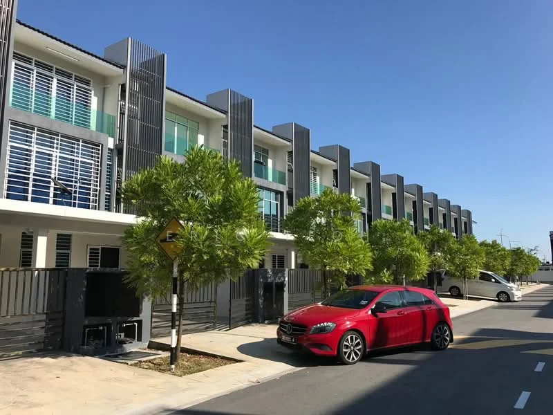 Exterior type: linked terrace house; features: grey painted facade, horizontal louvre screens, recessed balconies, two-storey structure, manicured landscaping with small trees, paved driveway, single-car parking space, surrounded by residential street, clear blue sky, modern architectural design; style: modern.