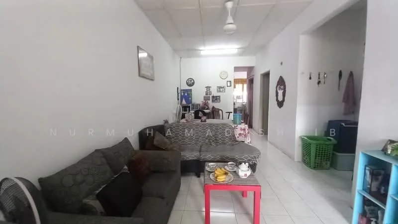 Living features: 3-seater fabric sofa in grey, 2-seater sofa with patterned upholstery, coffee table, wall-mounted TV, ceiling fan, white painted walls, tile flooring, decorative wall art, green laundry basket, open shelving unit, framed photographs, decorative mirror.