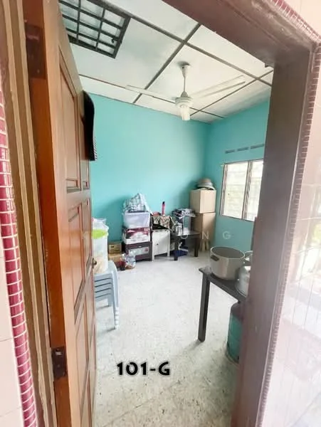 Room features: light blue painted walls, ceiling fan, tile flooring, wooden door, window with natural light, storage cabinets, plastic chairs, various household items.