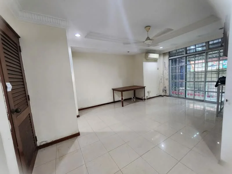 Living features: white painted walls, polished ceramic tile flooring, tray ceiling, 5-blade ceiling fan, floor-to-ceiling windows, sliding glass door, air conditioning unit, wooden door with louvered panels, table, natural light from windows.