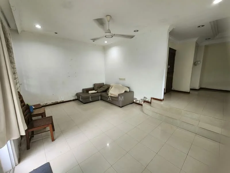 Living features: cream painted walls, white ceiling, 5-blade ceiling fan, tile flooring, corner sofa in grey, wooden chairs, large windows with sheer curtains, step-up area, wall with minor damage.