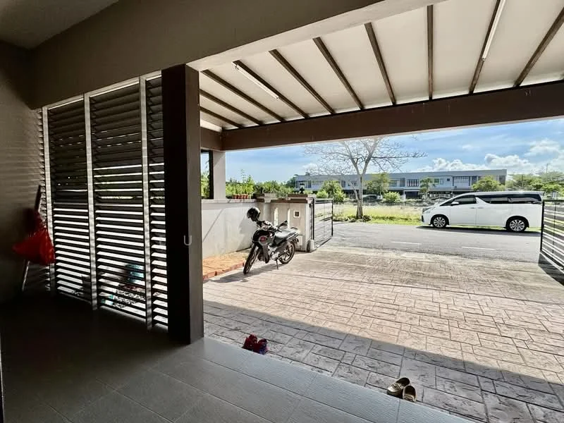 Exterior type: linked terrace house; features: covered porch, sliding louvered panels, stamped concrete flooring, motorcycle parked, street view, landscaped area, open space, driveway, front gate; style: modern.