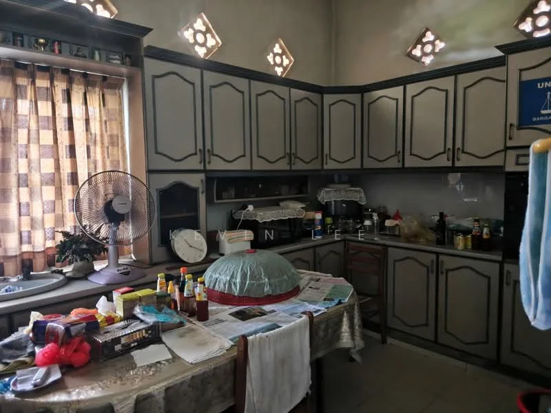 Kitchen features: grey cabinetry with decorative trim, marble countertop, single-bowl stainless-steel sink, chrome pull-down faucet, built-in oven, freestanding gas range, microwave, ceiling fan, window with checkered curtain, tile flooring, wall-mounted clock, decorative wall cutouts, various condiments and cooking utensils on countertop; style: traditional.