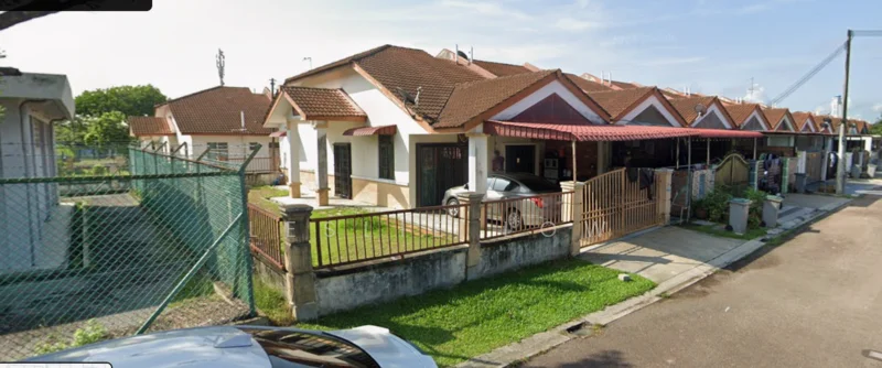 Exterior type: linked terrace house; features: single-storey, red tiled roof, cream painted facade, front garden with grass, metal gate, driveway with interlocking pavers, fenced perimeter, car parked in driveway, adjacent houses, street view, surrounded by greenery; style: modern.