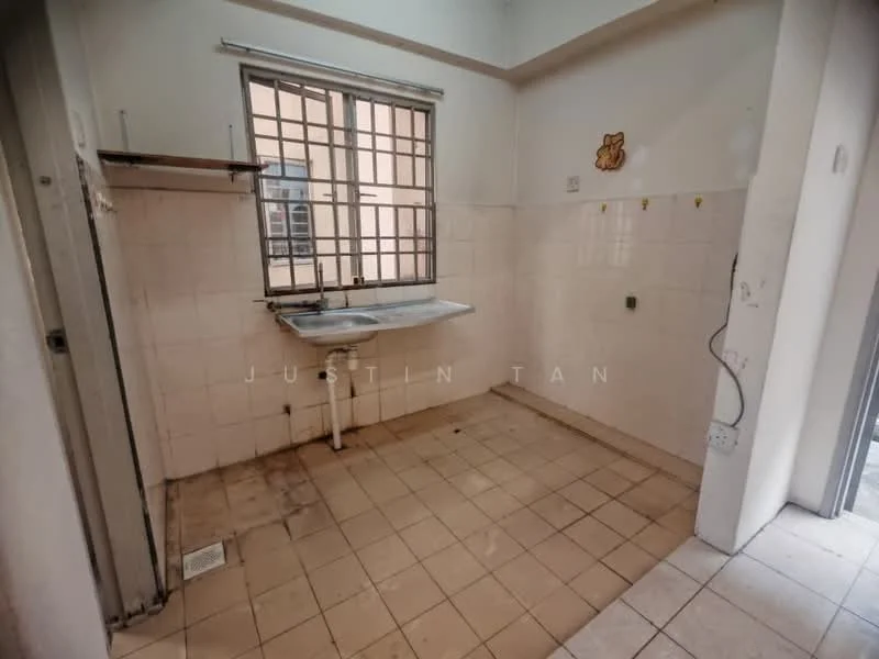 Kitchen features: single-bowl stainless-steel sink, chrome faucet, white tiled walls, cream tiled flooring, window with metal grille, wall-mounted shelf, empty wall space, no visible appliances.