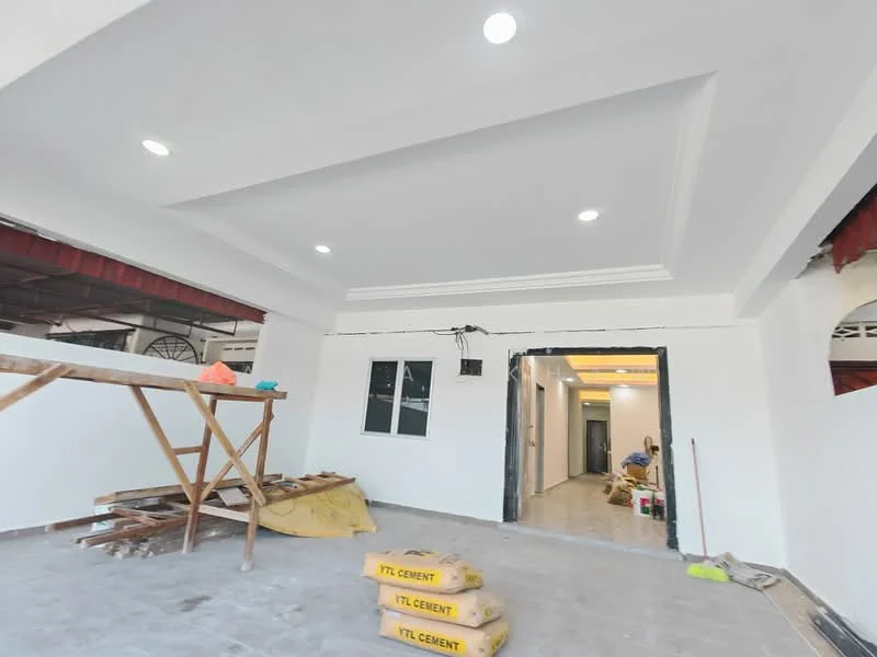 Room features: white painted walls, dropped ceiling with recessed lighting, tile flooring, two windows, open layout, unfinished construction materials visible, exposed electrical wiring, ceiling rose, light fixtures installed; style: modern.