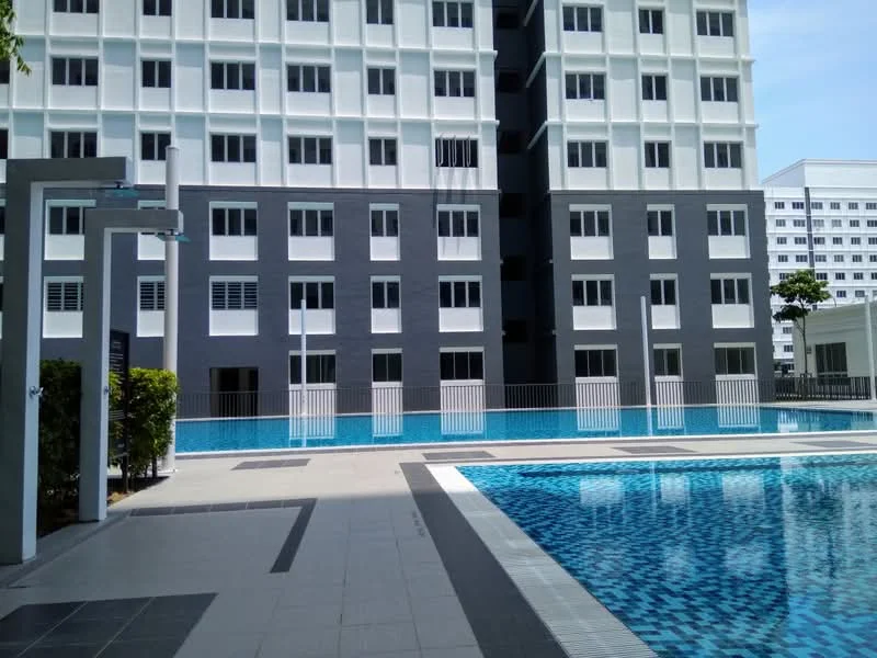 Exterior type: mid-rise condominium; features: swimming pool, pool deck with loungers, white painted facade, grey accent wall, floor-to-ceiling windows, manicured landscaping, fenced pool area, outdoor seating area; style: modern.
