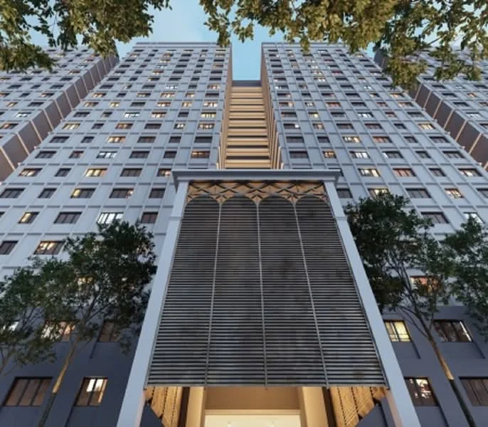 Exterior type: high-rise condominium; features: glass curtain wall, grey painted facade, recessed balconies, vertical fins, feature lighting at night, manicured landscaping with trees, double-volume main lobby entrance; style: modern.