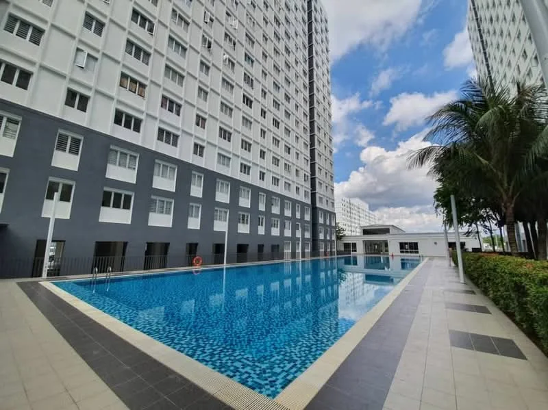 Exterior type: high-rise condominium; features: swimming pool, pool deck with loungers, surrounding landscaping with shrubs, grey and white facade, multiple storeys, large windows, palm trees, open sky, tile flooring around pool, lifebuoy on poolside; style: modern.
