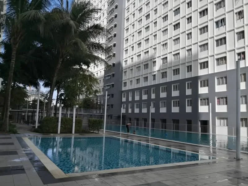 Exterior type: high-rise condominium; features: swimming pool, landscaped garden area, palm trees, tiled pool deck, multiple floors of residential units, glass windows, balconies on upper floors, manicured greenery; style: modern.