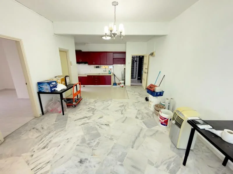 Living features: marble flooring, white painted walls, chandelier, kitchenette with red cabinetry, white tiled backsplash, single-bowl stainless-steel sink, freestanding air conditioning unit, table with black surface, cleaning supplies visible, open layout, doorway leading to other rooms; style: modern.