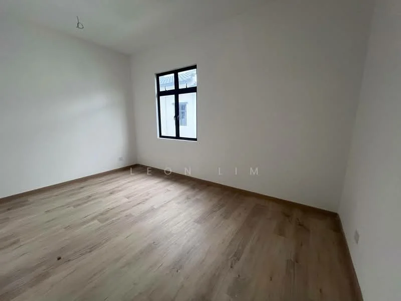 Room features: white painted walls, wooden flooring, single window with black frame, no visible ceiling fixtures.