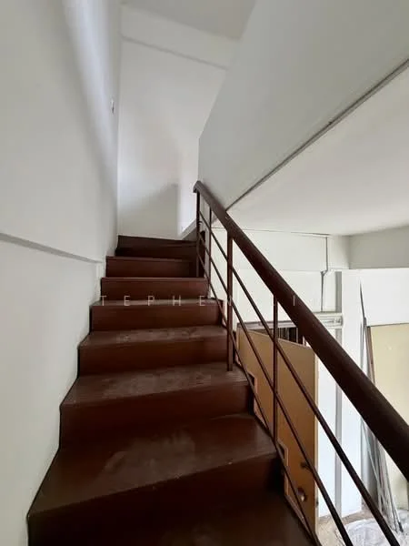 Room features: staircase with metal railing, brown painted steps, white walls, natural light from upper level, landing area at top of stairs; style: modern.