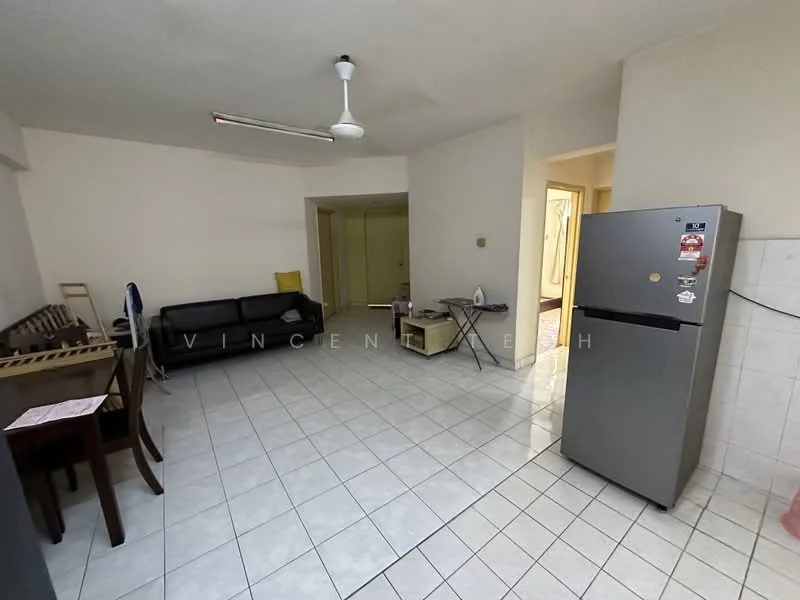 Living features: white painted walls, ceramic tile flooring, 5-blade ceiling fan, black leather sofa, wooden dining table with chairs, stainless-steel fridge, folding table, built-in wardrobe, doorway to other rooms.