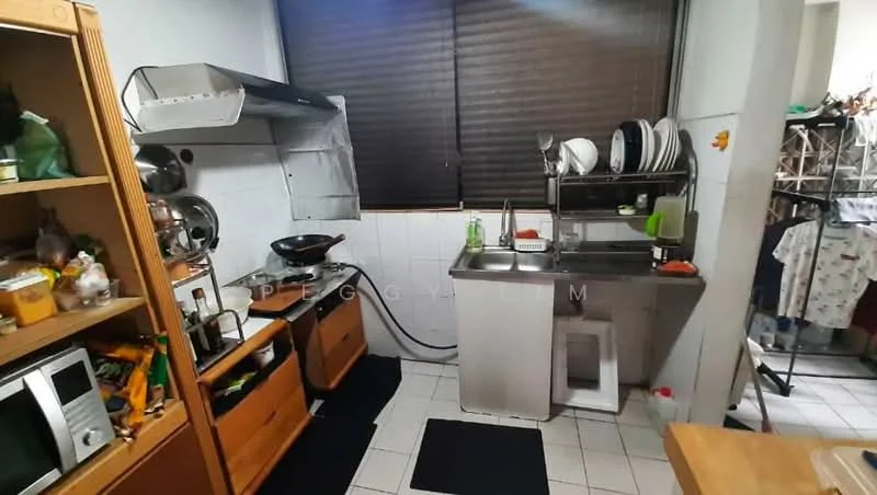 Kitchen features: stainless-steel sink, chrome pull-down faucet, built-in gas stove, stainless-steel range hood, wood cabinetry, open shelving, white tiled walls, white tiled flooring, black rubber mats, window with blinds, cooking utensils visible, dish rack with plates, laundry area visible.