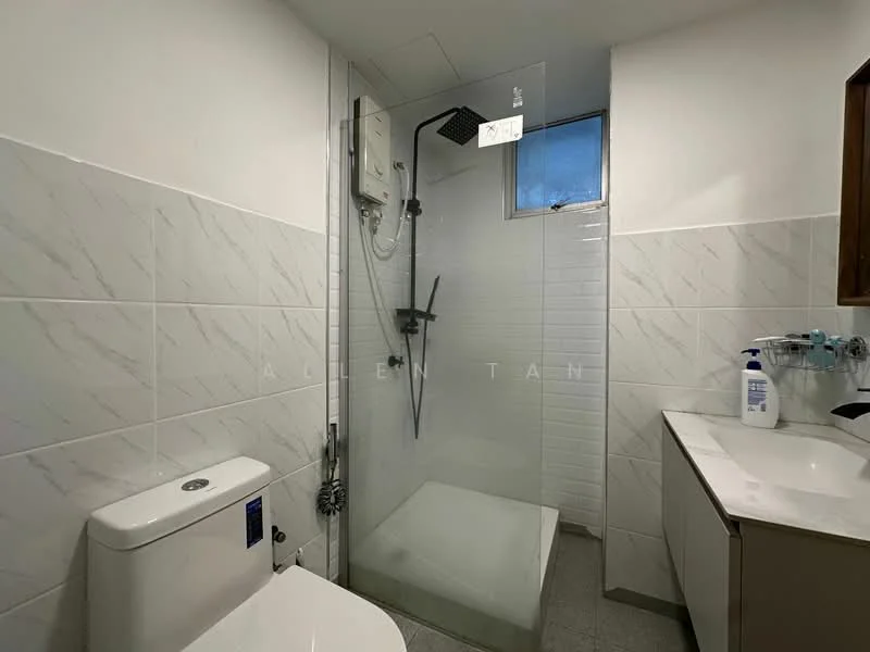 Bathroom features: walk-in shower with glass enclosure, rain shower head, handheld shower, white ceramic toilet, single-sink vanity with wood cabinet, mirror above vanity, white tiled walls, grey floor tiles, shower wall with white tiles, window for natural light; style: modern.