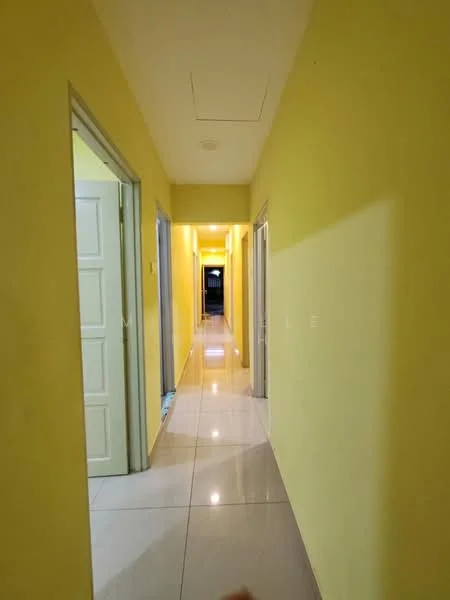 Hallway features: yellow painted walls, glossy tile flooring, recessed ceiling lights, doorway to rooms on both sides, straight corridor layout; style: modern.